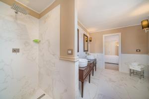 Koupelna v ubytování Hotel Cala Lunga