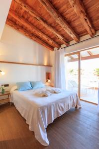 מיטה או מיטות בחדר ב-Es Pas Formentera Agroturismo