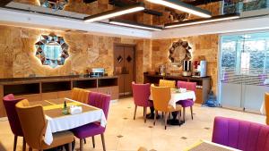 a restaurant with tables and chairs in a room at My Garden Hotel in Istanbul