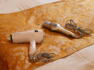 a hair dryer sitting on top of a table at Hotel Grand Fine Kyoto Minami in Kyoto