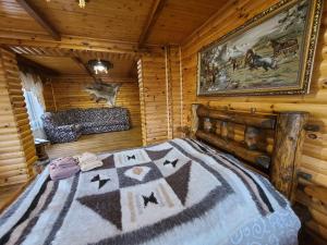 Postel nebo postele na pokoji v ubytování Гуцульська хата