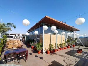 a building with tables and chairs in front of it at The Jawai Gateway in Sheoganj