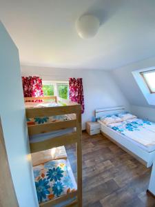 Postel nebo postele na pokoji v ubytování Apartmány Klárka