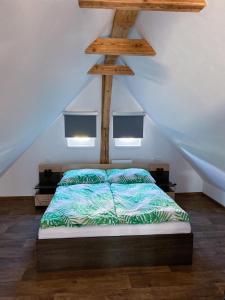 Postel nebo postele na pokoji v ubytování Apartmány Klárka