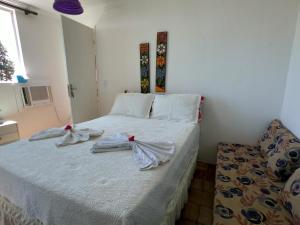 A bed or beds in a room at Apartamento Praça Nove