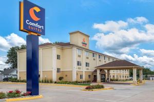 a hotel with a sign in front of a building at Comfort Suites Terre Haute University Area in Terre Haute