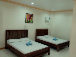 Cama o camas de una habitación en Tubod Flowing Water Resort