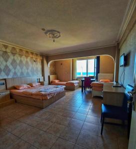 A bed or beds in a room at KILIÇ MOTEL Még 11 kép