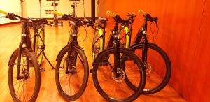 three bikes are lined up against a wall at Hotel Cala Del Porto in Vibo Valentia Marina