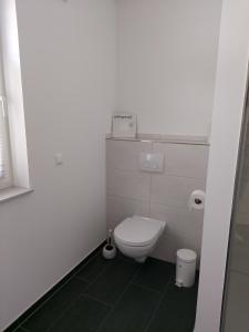 Ένα μπάνιο στο Ferienwohnung Langgöns