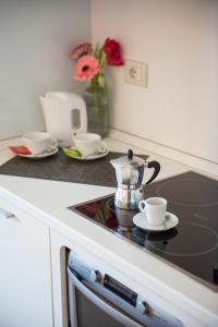 Кухня или мини-кухня в Hotel Dimorae Rooms and Suites - Apartments
