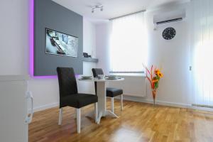 TV in/ali zabaviščno središče v nastanitvi MANIROSI 3 apartman
