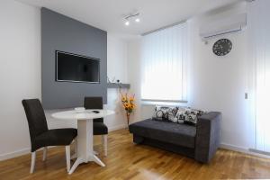 TV a/nebo společenská místnost v ubytování MANIROSI 3 apartman