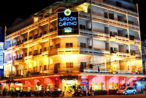 a building with a sign on the side of it at Saigon Can Tho Hotel in Can Tho