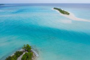 an aerial view of an island in the ocean at Veli Beach Inn in Mathiveri +84 photos