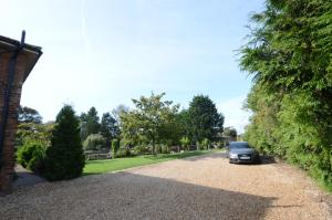 a car parked in the driveway of a house at Lakeside Old Hunstanton in Hunstanton