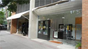 a store front of a building with a person in the window at La Concepcion, Providencia Suites in Santiago