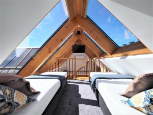 a room with four beds in a attic at VIP Apartamenty ROYAL SPA in Zakopane