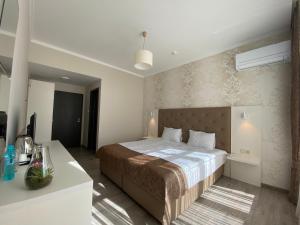Ένα ή περισσότερα κρεβάτια σε δωμάτιο στο Comfort Guest Rooms