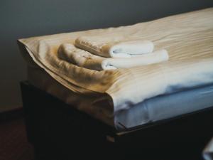 Łóżko lub łóżka w pokoju w obiekcie Legnicki Browar Książęcy Hotel i Restauracja