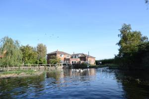 a house on the side of a river at Lakeside Old Hunstanton in Hunstanton