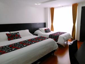 Ένα ή περισσότερα κρεβάτια σε δωμάτιο στο Hotel Palermo Suite