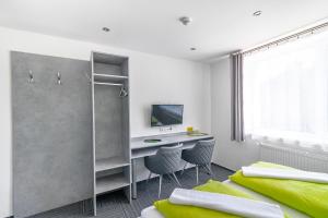 TV a/nebo společenská místnost v ubytování Garni Hotel 31