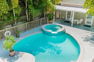 a swimming pool in a backyard with a pool at Key West Villas in Key West