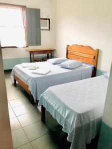 Postel nebo postele na pokoji v ubytování Pousada Gabriela
