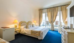 Postel nebo postele na pokoji v ubytování Hotel 4 Stagioni Sensus Spa + 34 fotografií