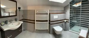 a bathroom with a toilet and a sink and a shower at B&B Il Casale in Foligno