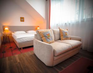 Postel nebo postele na pokoji v ubytování Hotel SPA Wieniawa