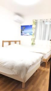 Säng eller sängar i ett rum på 竹内公寓