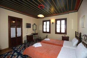 Postel nebo postele na pokoji v ubytování Papigiotis Hotel