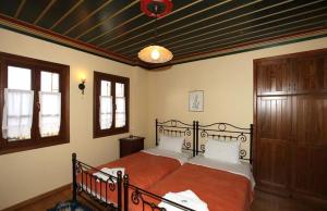 Postel nebo postele na pokoji v ubytování Papigiotis Hotel