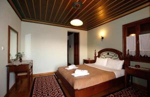 Postel nebo postele na pokoji v ubytování Papigiotis Hotel
