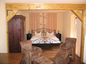 En eller flere senge i et værelse på Sonnenhof-Willingen