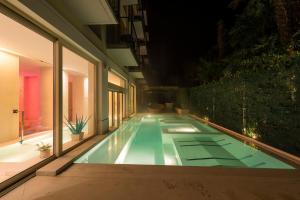 Bazén v ubytování Hotel 4 Stagioni Sensus Spa nebo v jeho okolí