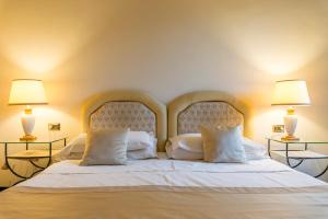 Postel nebo postele na pokoji v ubytování Hotel 4 Stagioni Sensus Spa