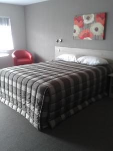 Postel nebo postele na pokoji v ubytování Carramar Motor Inn