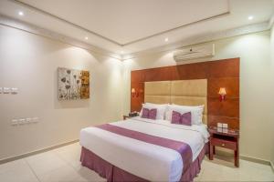 Ένα ή περισσότερα κρεβάτια σε δωμάτιο στο Al Muhaidb Khanshalila