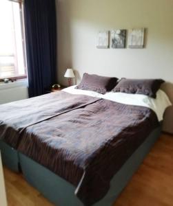 En eller flere senge i et værelse på Enjoy Ylläs - Cozy top floor apartment