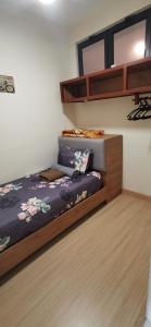 Ένα ή περισσότερα κρεβάτια σε δωμάτιο στο Farish's Suite D' TimurBay Seafront Residence-By Azharieta