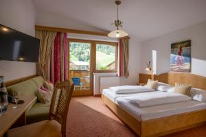 Postel nebo postele na pokoji v ubytování Hotel Pension Wiesenhof