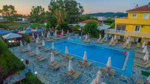 an overhead view of a pool with chairs and umbrellas at Macedonia in Kalamaki