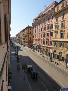 an empty street in a city with buildings at Correa Vatican Hospitality in Rome