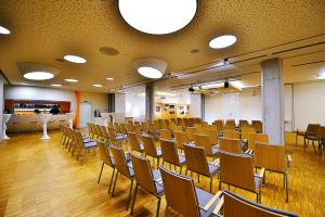 a room with rows of chairs in a classroom at Antonie Hotel****superior in Frýdlant +36 photos