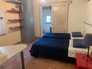 Posteľ alebo postele v izbe v ubytovaní Relais del Lago e Relais del Monte