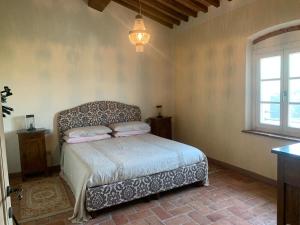 Posteľ alebo postele v izbe v ubytovaní Relais del Lago e Relais del Monte