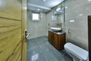 a bathroom with a sink and a mirror at The Montreal Srinagar A Unit Of Montreal Group in Srinagar +77 photos